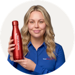 Total Branded employee Alex holding the Cove Water Bottle