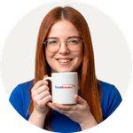 Total Branded employee Emma holding the Cambridge Mug
