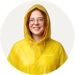Total Branded employee Emma wearing the Ada Raincoat