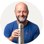 Total Branded employee Nathan holding the Sullivan Vacuum Insulated Flask