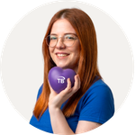 Total Branded employee Emma holding the Heart Stress Item