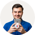 Total Branded employee Leighton holding the Brace Phone Stand with Grip