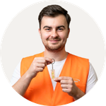 Total Branded employee Leighton wearing the Hi Vis Vest and holding the Leveler keychain