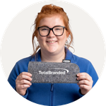 Total Branded employee Phoebe holding the Felta GRS Recycled Pouch for Glasses